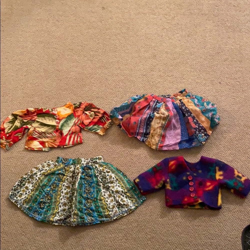 Assorted doll tops and skirts